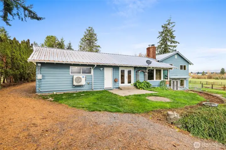 Backyard offers space for a fire pit and convenient access to the wood shed—perfect for cozy evenings.