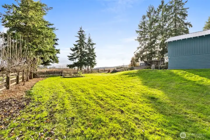 Enjoy the outdoors in a fully fenced yard with ample room for gardening or peaceful relaxation.