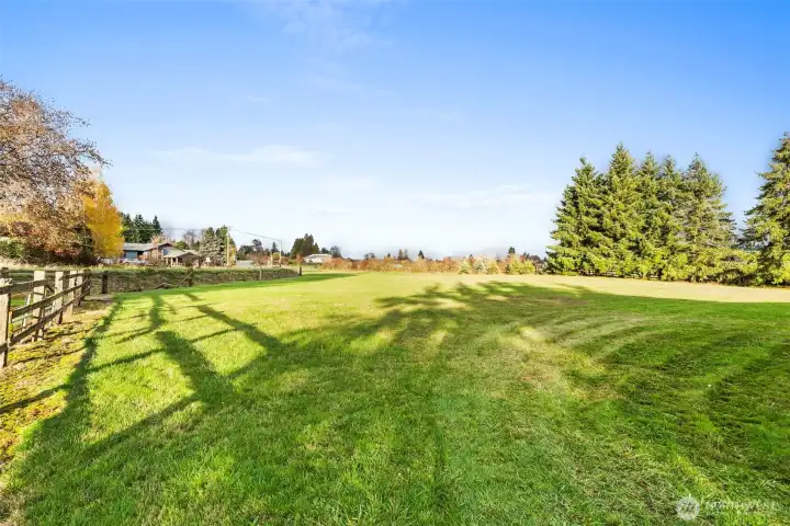 A spacious field provides flexibility for pasture, additional gardening, or maybe adding a greenhouse or two. It is hard to find this much land so close to town and within walking distance of the hospital.