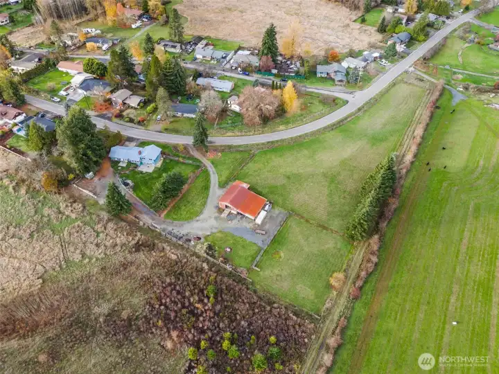Bird’s-eye view of the house, shop/barn, and surrounding pasture—plenty of room to spread out.