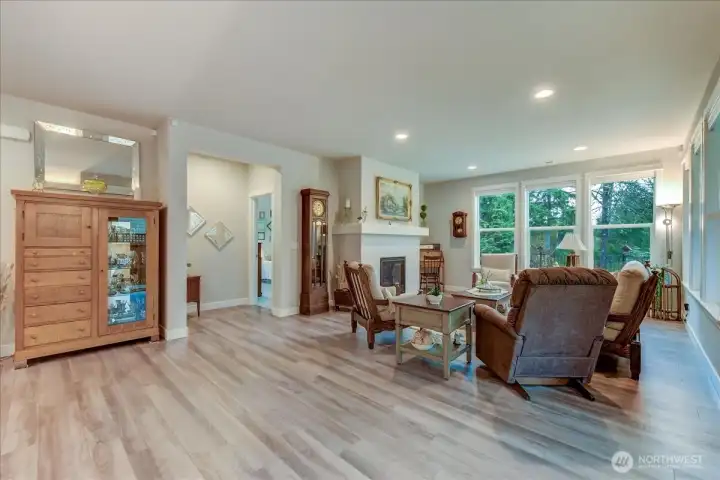 Living Room with Gas Fireplace & Tall windows for tons of natural light.