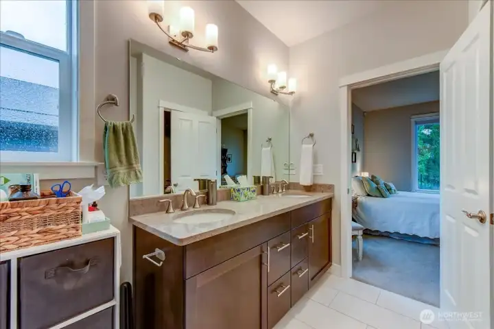 Primary Bathroom complete with His & Her sinks, large vanity, Glass Surround Shower, and spacious Walk-In Closet