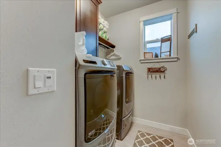 Laundry Room With Newer Front Loading Washer & Dryer