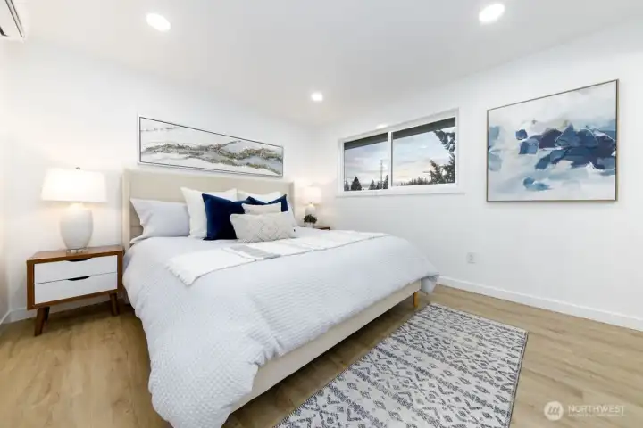 Primary bedroom with ensuite bath and walk-in closet