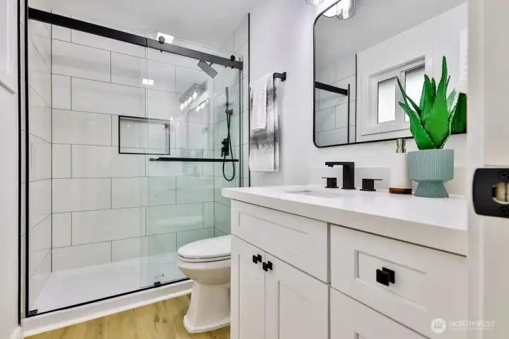 Primary bedroom with ensuite bath and walk-in closet