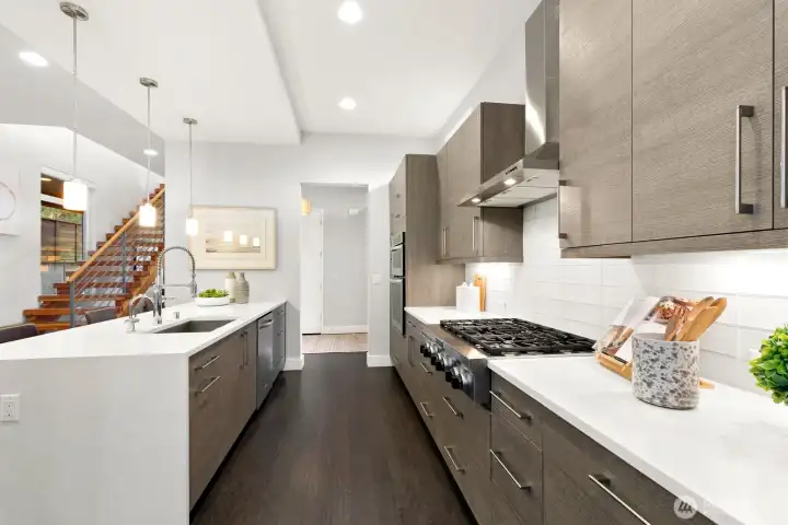 Another view of this stunning kitchen w ample cabinetry & counter space