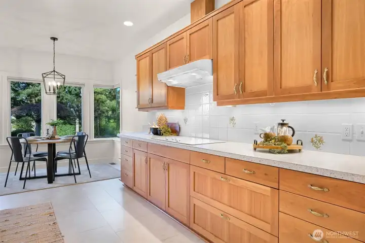 Elegant cherry cabinetry, crafted by a renowned designer, durable and classic.