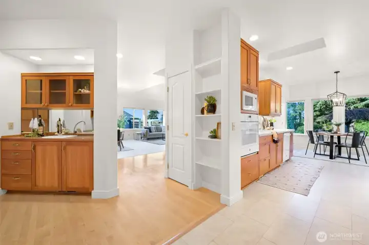 Effortless kitchen-to-family room flow, featuring a stunning wet bar.