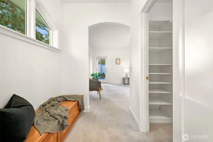 Adjacent to the walk-in closet, a window seat with storage adds thoughtful convenience.