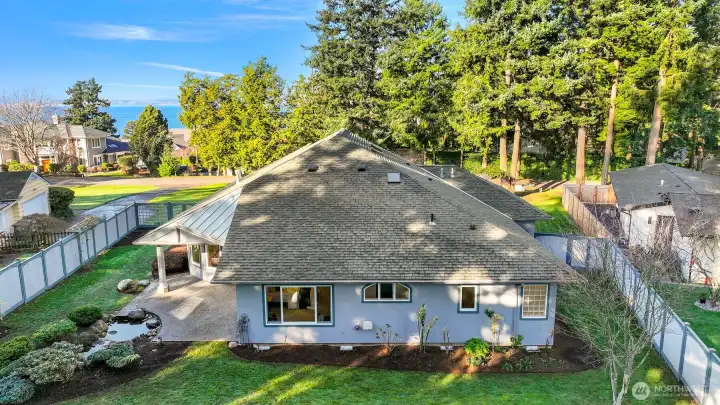 Rear view of home showcasing stunning water views.