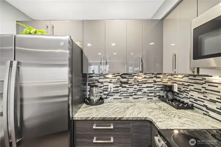 Granite countertops, tiled backsplash, plenty of storage space...