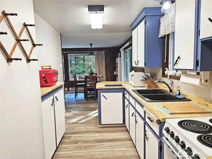 Enter through the very usable kitchen in the back of the home.