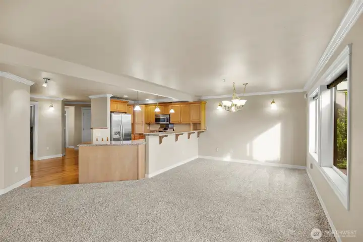 Spacious dining space with eating bar.