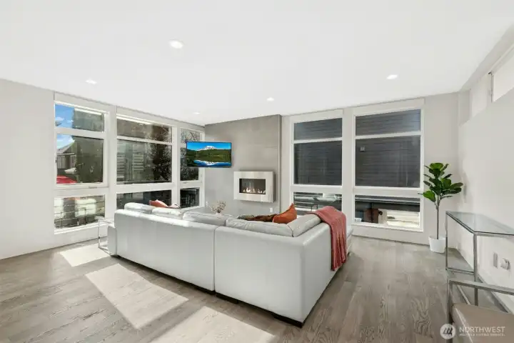 Light-filled living room with dramatic floor-to-ceiling windows