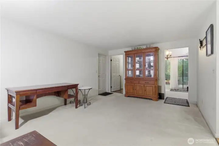 From the family room you can see the garage access door and utility room to the left and dining roon to the right.