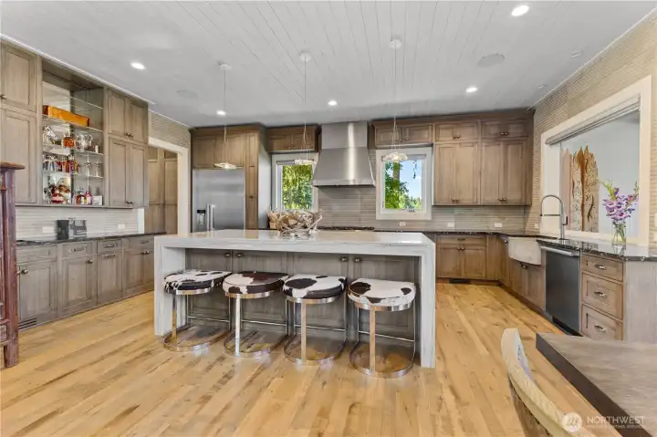 Large Kitchen with Cerused oak finish Plato custom cabinetry   Miele appliances – Large Island – eight burner range with double oven, warming drawer, dishwasher, refrigerator, freezer. Backsplash in kitchen is premium grade Italian tile