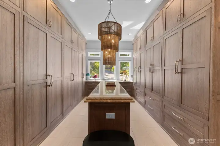 Primary closet with built in Cerused oak finish Plato cabinetry