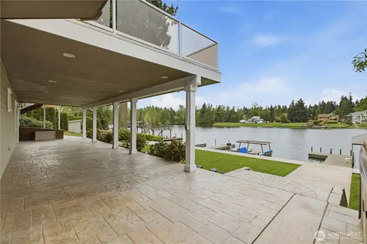Large stamped concrete patio with dry deck