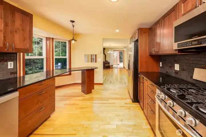 Large kitchen with gas stove, plenty of counterspace.