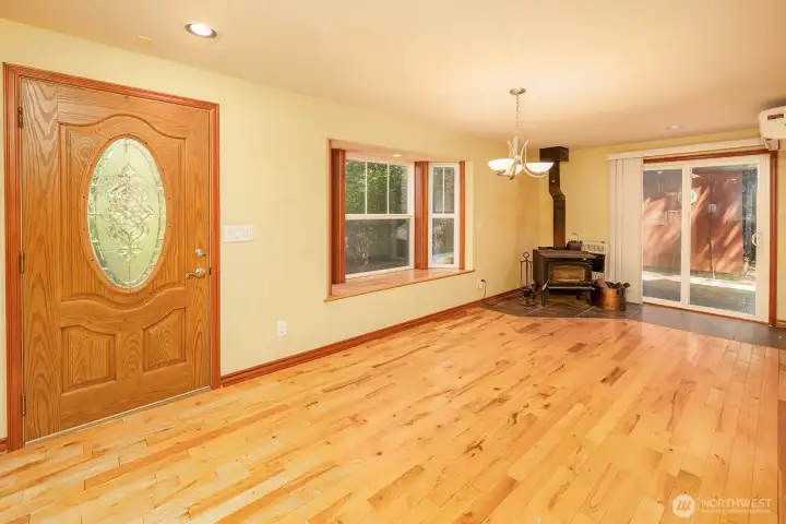 Side entrance to living area with wood fireplace.