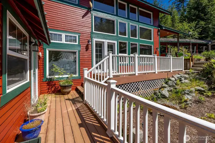 Deck extends to the back yard and second structure.