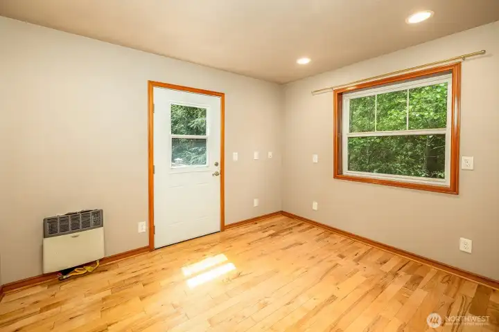 Bedroom with walkway into the trees.
