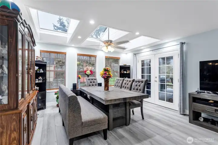 Massive Dining room with tons of natural light and French doors that lead out on the back deck.