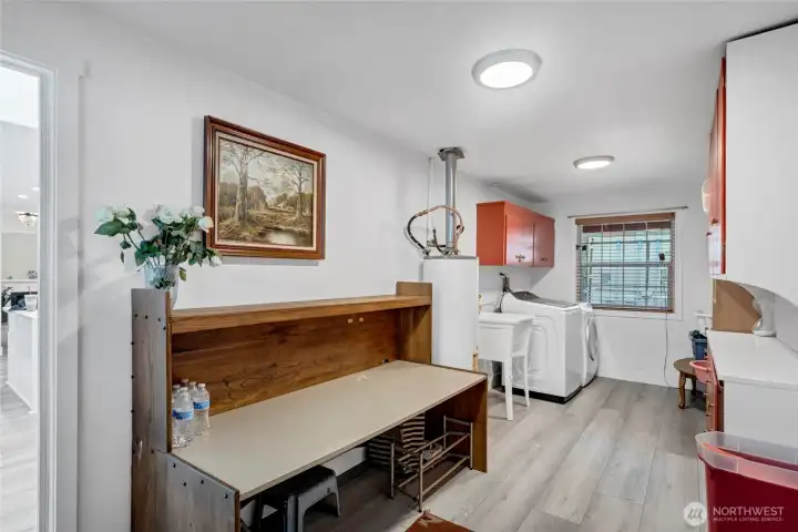 Large Laundry room with tons of counter and cabinet space.Utility sink as a bonus
