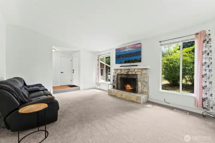 Living room with wood burning fire place