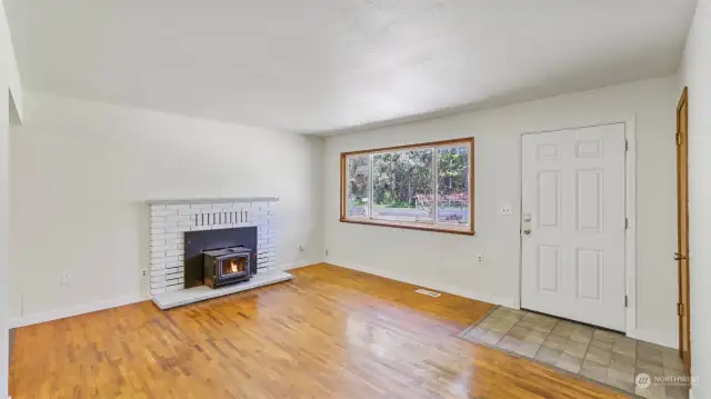 Enter this home and fine the original hardwood flooring along with a cozy fireplace.