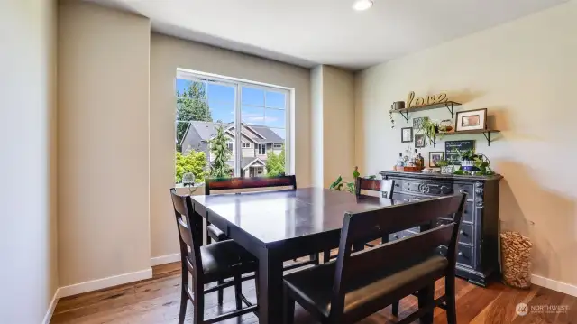 Dining space just off the kitchen overlooks the tranquil tree lined street.