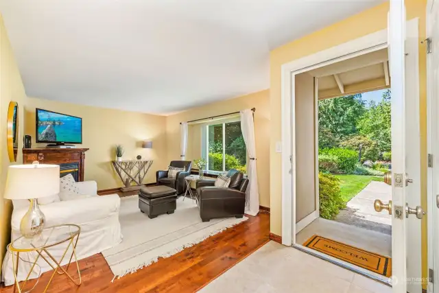 Just by taking a look outside the front door, you can see that nature and privacy were key design elements in this home! No neighbors in sight, just the mature gardens and flowering bushes!