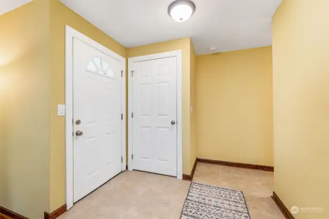 A welcoming front door and a separate front hall closet for coats - perfection! No need to use the bed in the guest room for coats! :)