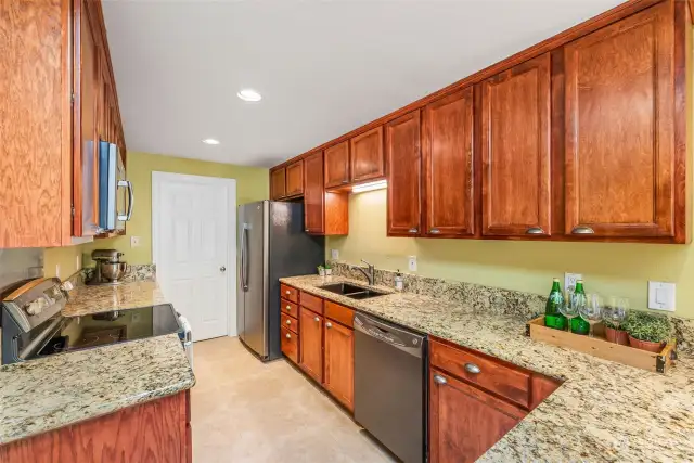 Have a closer look at the stunning cabinetry! Dark appliances look modern, and the double sink is a must!