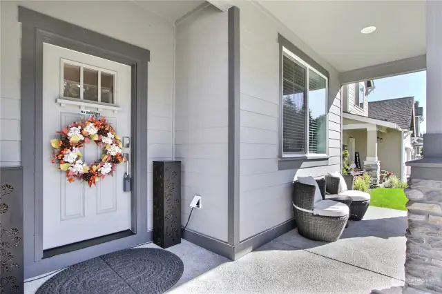 Welcome to the inviting covered front porch—a perfect spot to enjoy your morning coffee, relax with a good book, or greet friends and neighbors. With plenty of space for cozy seating, potted plants, or seasonal decor, this charming outdoor area extends a warm welcome and offers a delightful retreat to unwind and enjoy the surrounding scenery year-round.