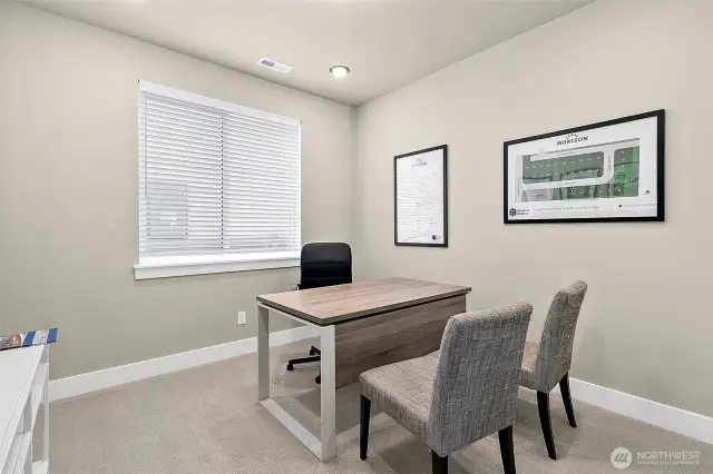 Main floor bedroom/office/den with a closet