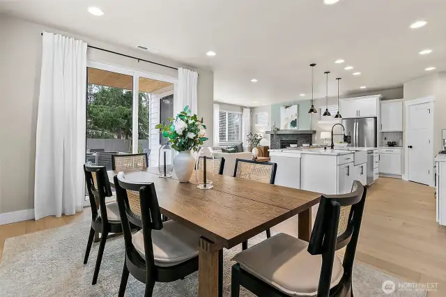 Open concept dining area to kitchen and family room
