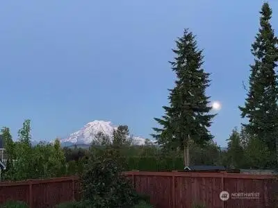 A Sunrise house with fabulous Mount Rainier views from all East facing windows!
