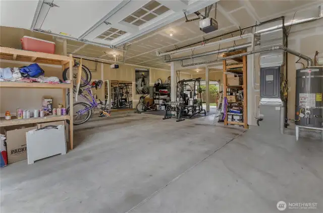 Incredible 1200+ SF Garage! Could hold up to 5 cars! 3 garage doors, 2 garage door openers. 1 garage door opens to backyard for easy access and storage. There's even a utility sink in the garage near the work bench. Lots of built -in storage, too!