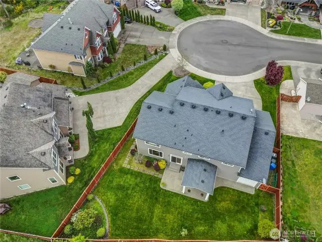 Fully fenced backyard provides security for trash and recycling bins in separate area from backyard or front yard.