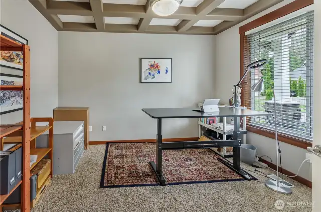 Den/Office/Guest Room is just off the main entry and is a classy space with a unique ceiling architecture.