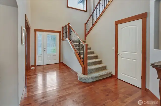 Large window above stairs has an electric blind!
