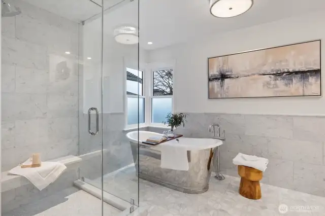 Glass enclosed Steam shower with marble slab bench, tumbled marble stone shower-pan and Polished Chrome Kohler Purist Faucets Collection.