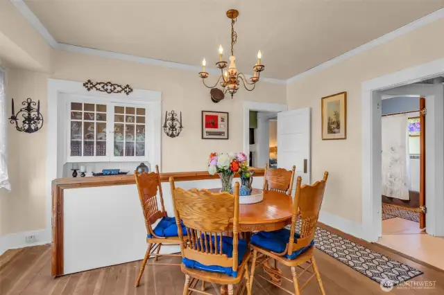 Dining and built in China cabinet. With stairs to lower level