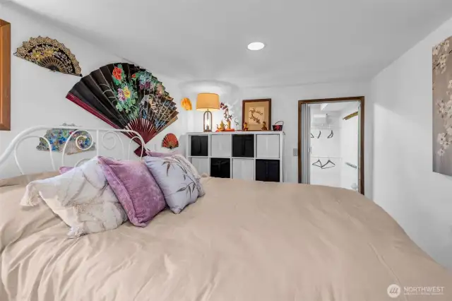 Lower level bedroom could be considered a secondary primary bedroom. with walk-in closet