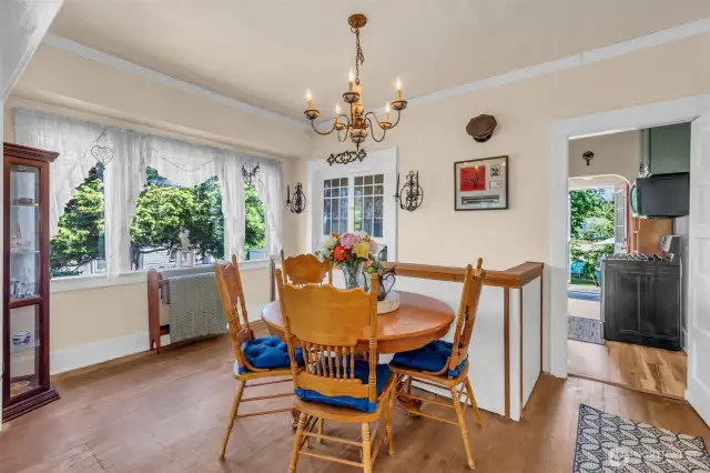 Dining room with built in original China cabinet. Gorgeous vintage chandelier