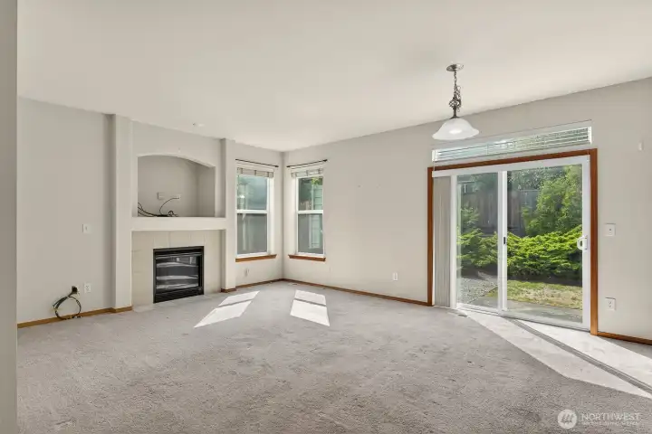 Family room with sliding glass doors that open onto the backyard patio