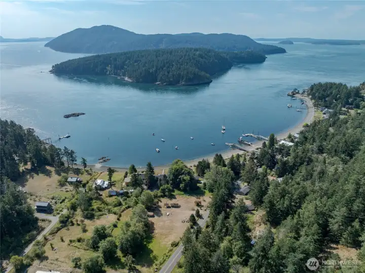 Aerial view showing Barnacle Ln community beach, public dock/boat launch, Obstruction Pass, Obstruction Island, and Blakely Island