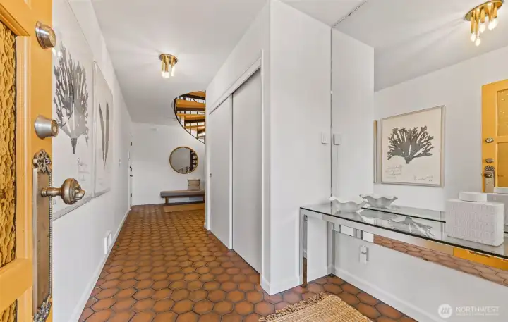 Entryway on lower level. Entrance from driveway directly to main floor, so you don't have to use the spiral staircase