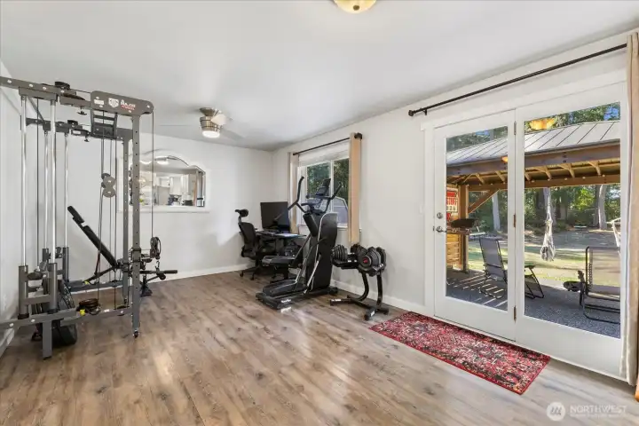 Another shot of the family room w/ a glass door to the backyard & patio.